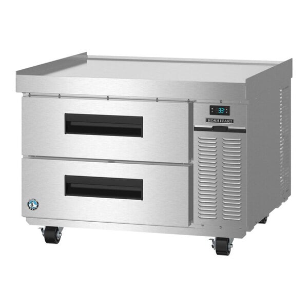 A stainless steel two-drawer refrigerated chef base on casters.