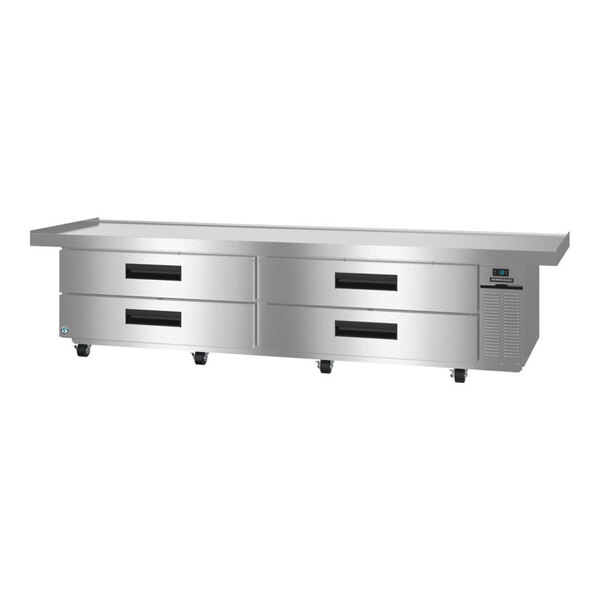 A large stainless steel refrigerated chef base with four drawers and a digital control panel.