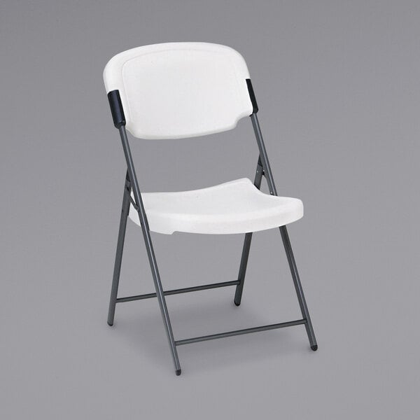 An Iceberg Rough N Ready Series white folding chair with black legs.