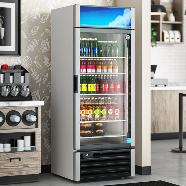 A Hoshizaki glass door refrigerator full of drinks.