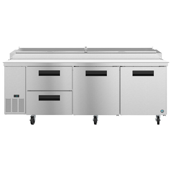 A stainless steel Hoshizaki refrigerated pizza prep table with drawers.