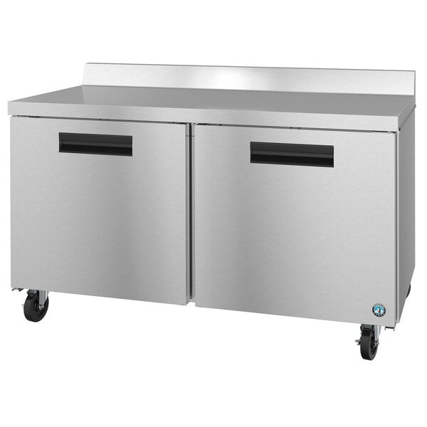 A Hoshizaki stainless steel worktop freezer with black handles.