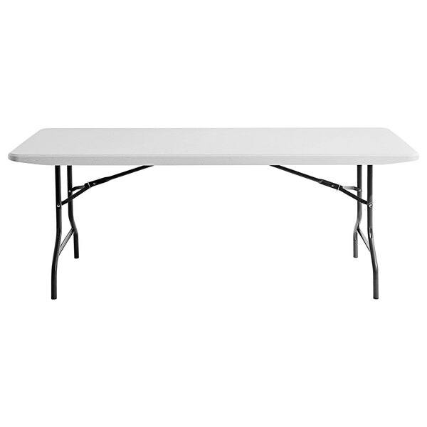A white rectangular table with black legs.