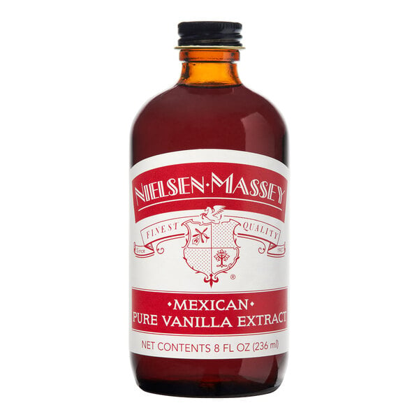 A close up of a Nielsen-Massey 8 fl. oz. bottle of Mexican Vanilla Extract with a white label.