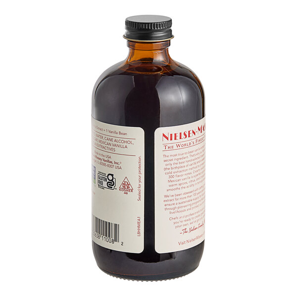 A bottle of Nielsen-Massey Mexican Vanilla Extract with a white label.