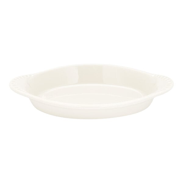 An oval-shaped, eggshell-colored china dish designed for serving Welsh rarebit.