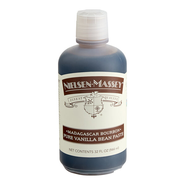 A bottle of Nielsen-Massey Madagascar Bourbon Vanilla Paste on a white counter.