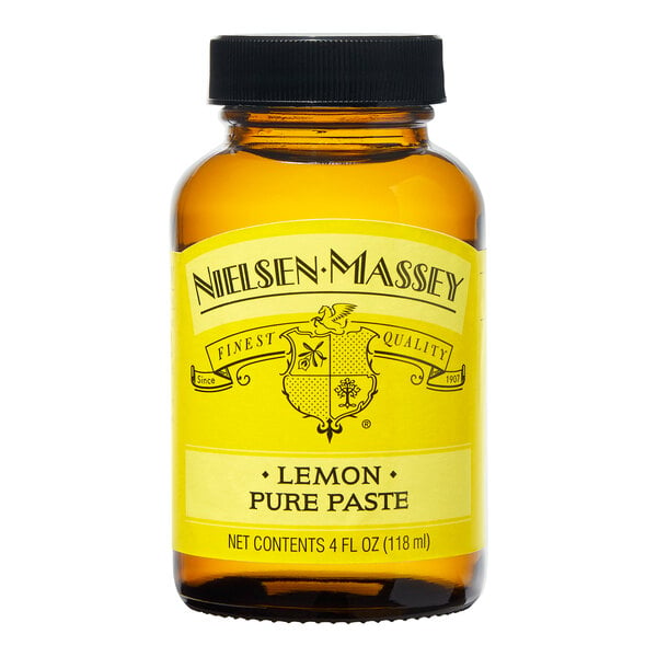 A 4 fl. oz. bottle of Nielsen-Massey Pure Lemon Paste on a counter.