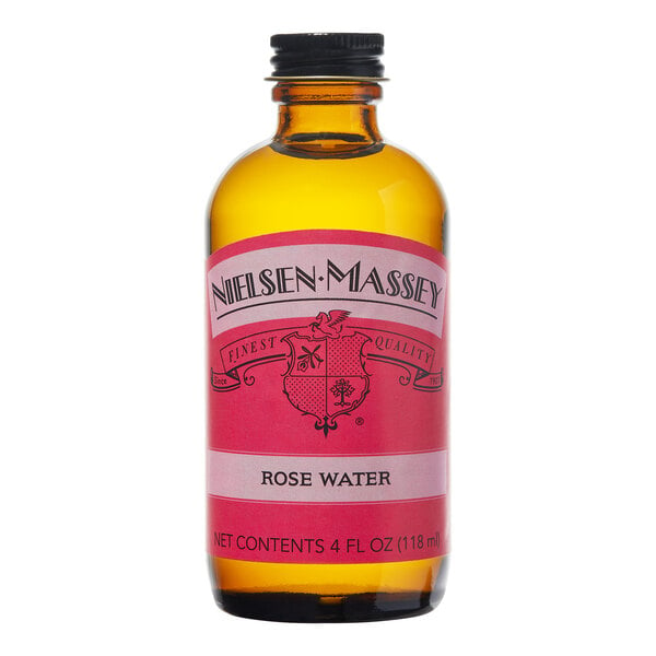 A close up of a Nielsen-Massey Rose Water bottle with a red label.