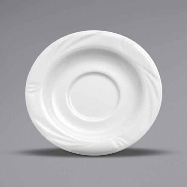 A white Oneida Buffalo Arcadia porcelain saucer with an embossed circular design.