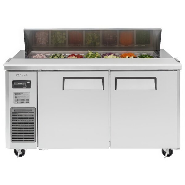 A white Turbo Air refrigerated sandwich prep table with food inside.