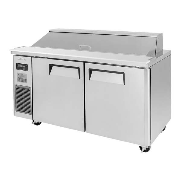 A Turbo Air stainless steel 2 door refrigerator with drawers on a counter.