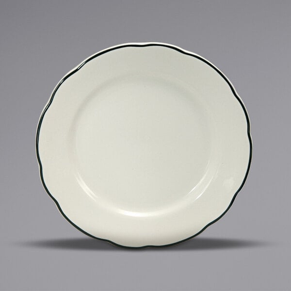 A white plate with a black trim.