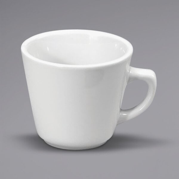 A white porcelain Vassar coffee cup with a handle.