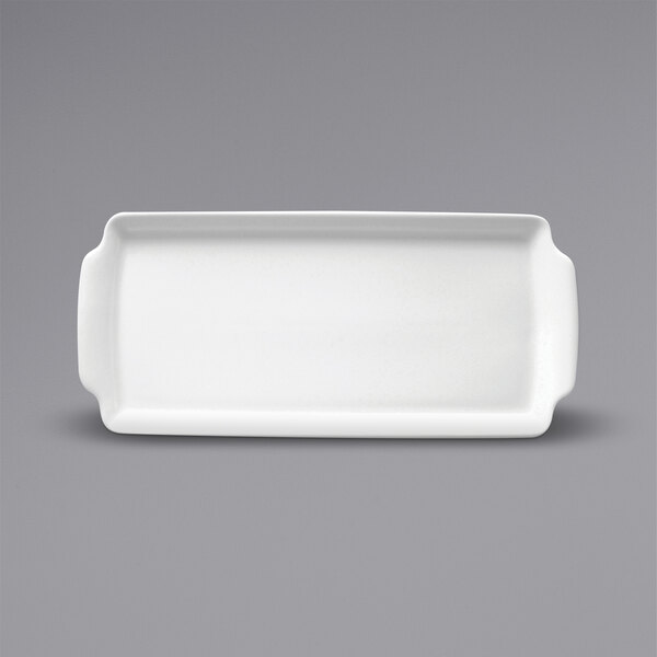 A white rectangular porcelain cake tray with a handle.