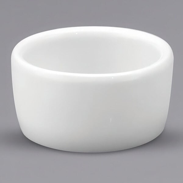 A close up of a white Oneida Buffalo porcelain ramekin.