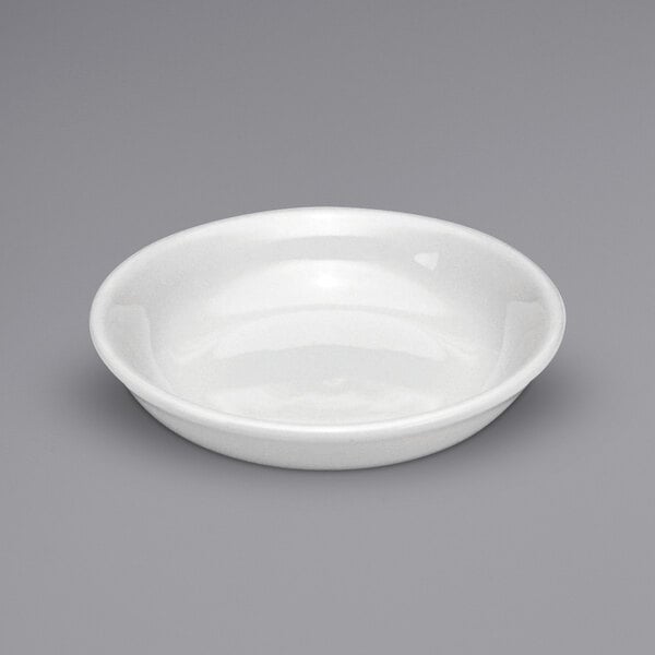 A white Oneida Buffalo coupe fruit bowl on a white surface.