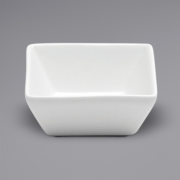 A white square Oneida Buffalo porcelain sauce dish.