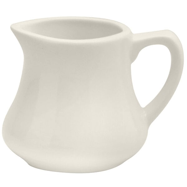 A Oneida Buffalo white porcelain creamer with a handle.