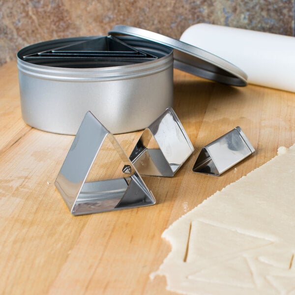 a metal cookie cutters on a table