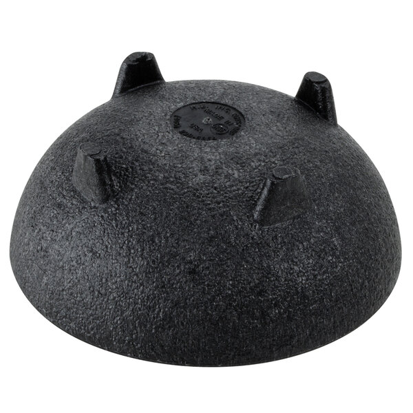 a black round object with four pointy holes