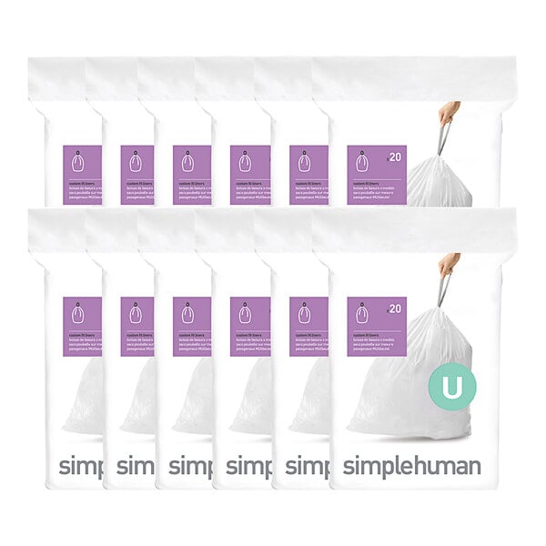 A group of white simplehuman Code U trash can liners in plastic packaging.