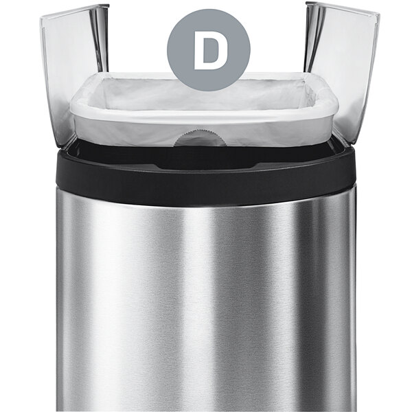 A simplehuman white trash can liner in a silver trash can.