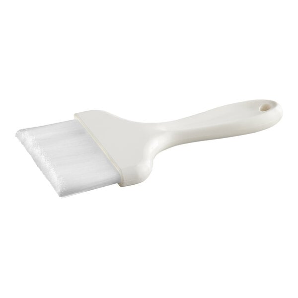 A white pastry or basting brush with nylon bristles and a plastic handle.