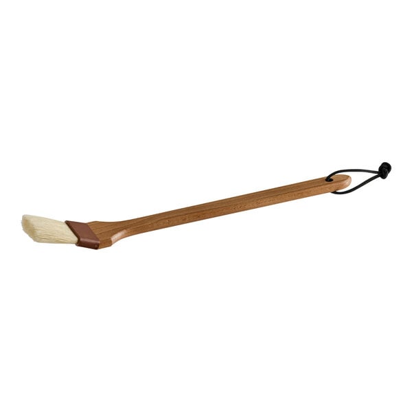 A Carlisle Sparta Chef Series boar bristle pastry brush with a wooden handle.