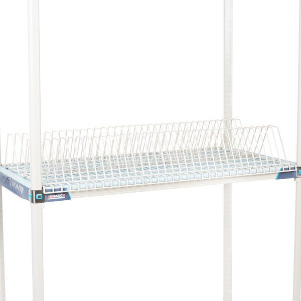 A white Metro Metromax iQ drying rack on a white Metro shelf.