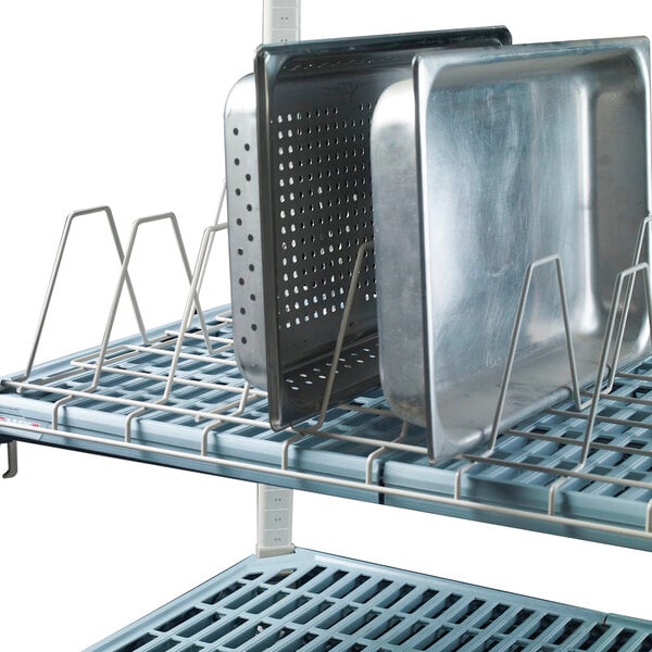 A Metro Metromax iQ drying rack with metal trays on it.