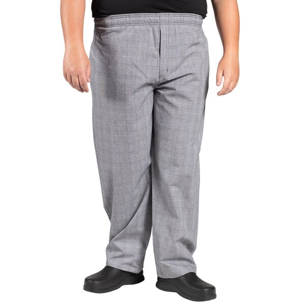A person wearing Uncommon Chef Glen Plaid chef pants.