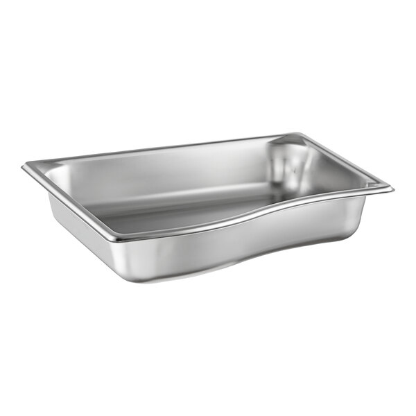 A Vollrath stainless steel pan with a curved edge.
