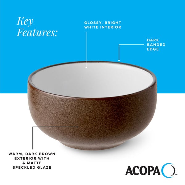 A stoneware bowl with a warm, dark brown matte speckled exterior, a glossy white interior, and a dark banded edge.