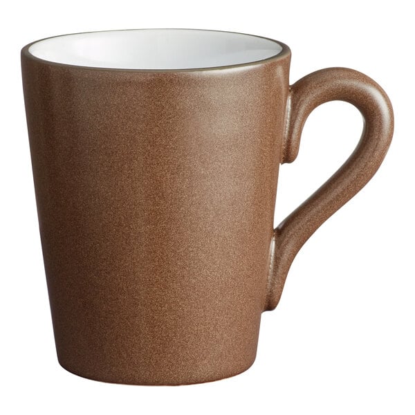 A brown matte stoneware mug with a handle and a white interior.