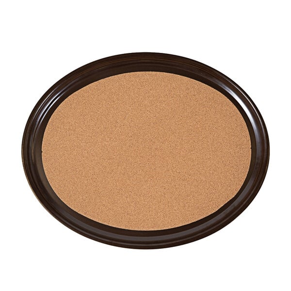 A brown oval tray with cork lining.