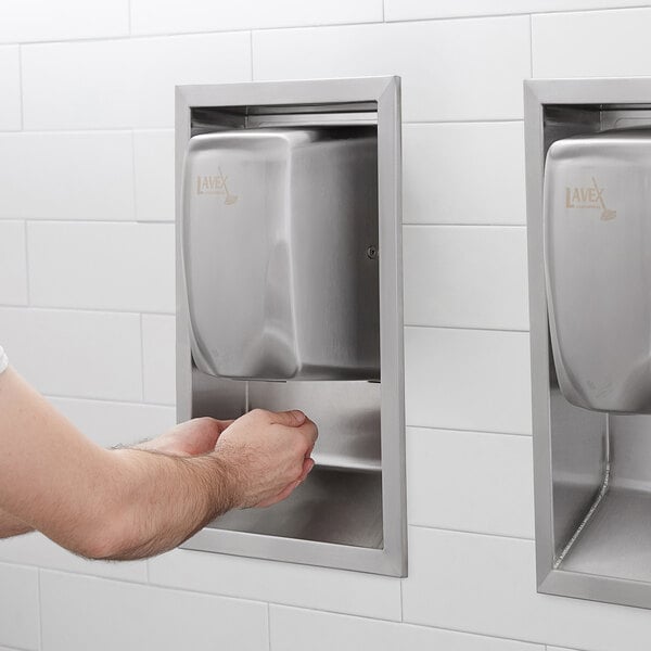a person washing hands in a hand sanitizer dispenser
