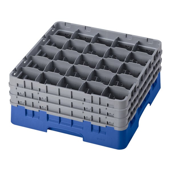 A blue plastic Cambro glass rack with 25 compartments and 3 extenders.