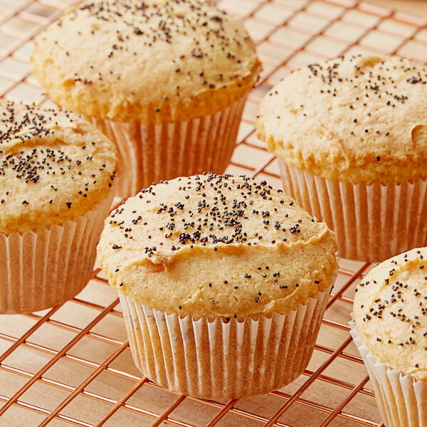 A cooling rack with Krusteaz muffins on it.