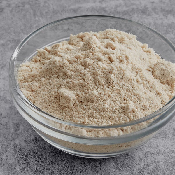 A bowl of Krusteaz spice cake mix on a table.