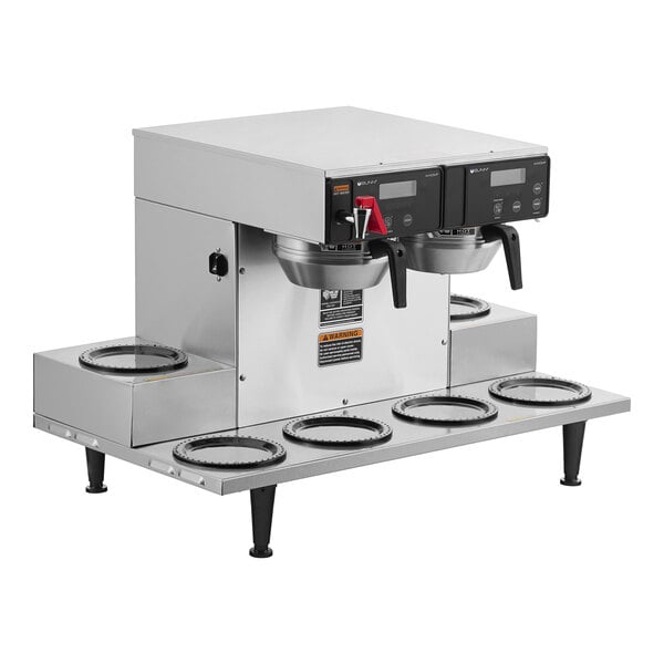 A Bunn commercial coffee brewer with six lower warmers on a counter.
