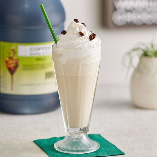 A glass of I. Rice coffee milkshake with a straw.