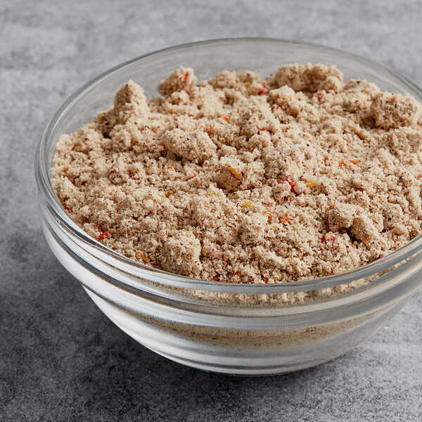A bowl of Krusteaz carrot cake mix on a table.