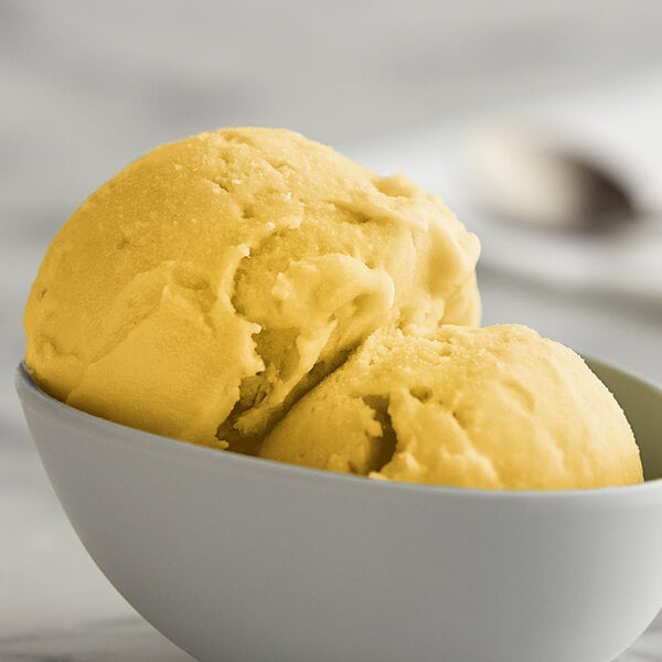 A bowl of yellow and white I. Rice Mango Water Ice