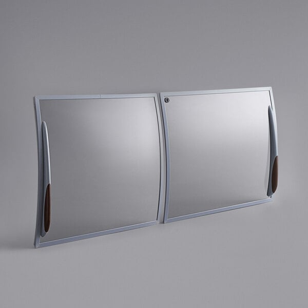 A pair of mirrors with handles over a white background.