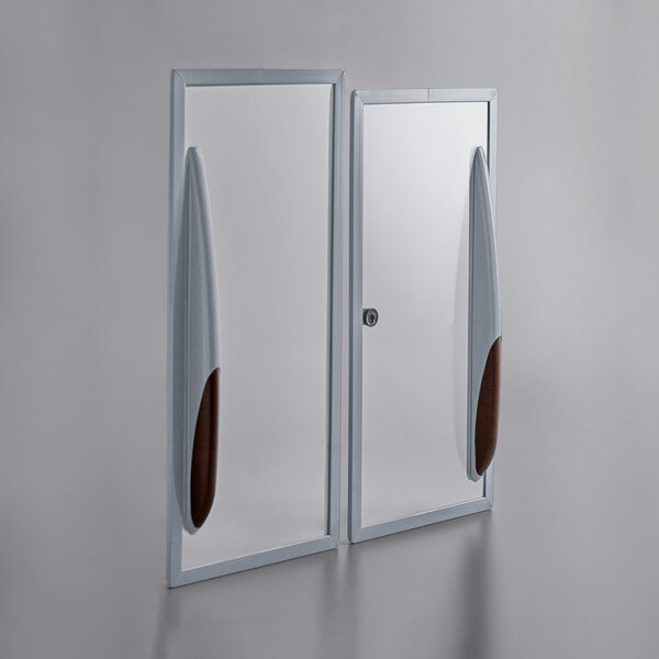 Two Avantco glass lids with handles for a commercial ice cream freezer.