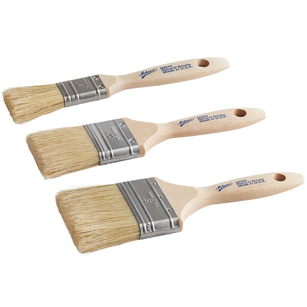 A set of three Ateco pastry and basting brushes with wooden handles.