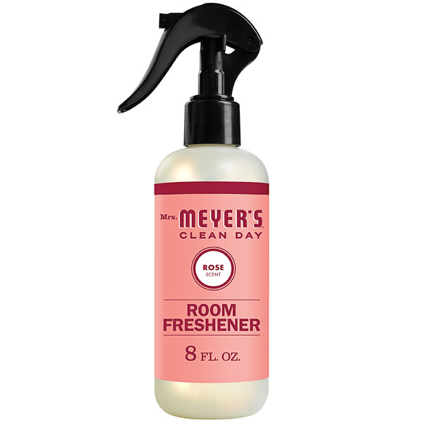 A bottle of Mrs. Meyer's Rose room freshener spray with a black sprayer.