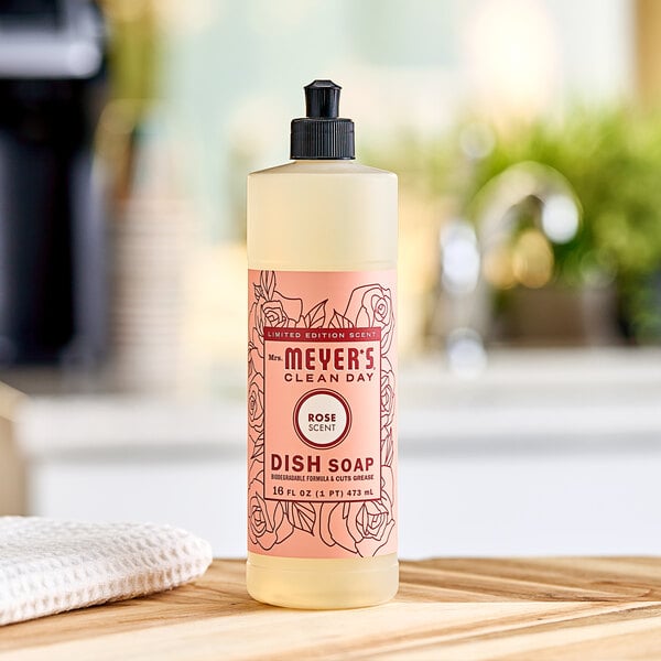 A Mrs. Meyer's Clean Day Rose scented dish soap bottle on a counter.