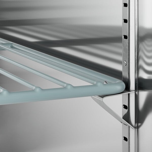 An Avantco stainless steel back bar cooler with metal shelves.